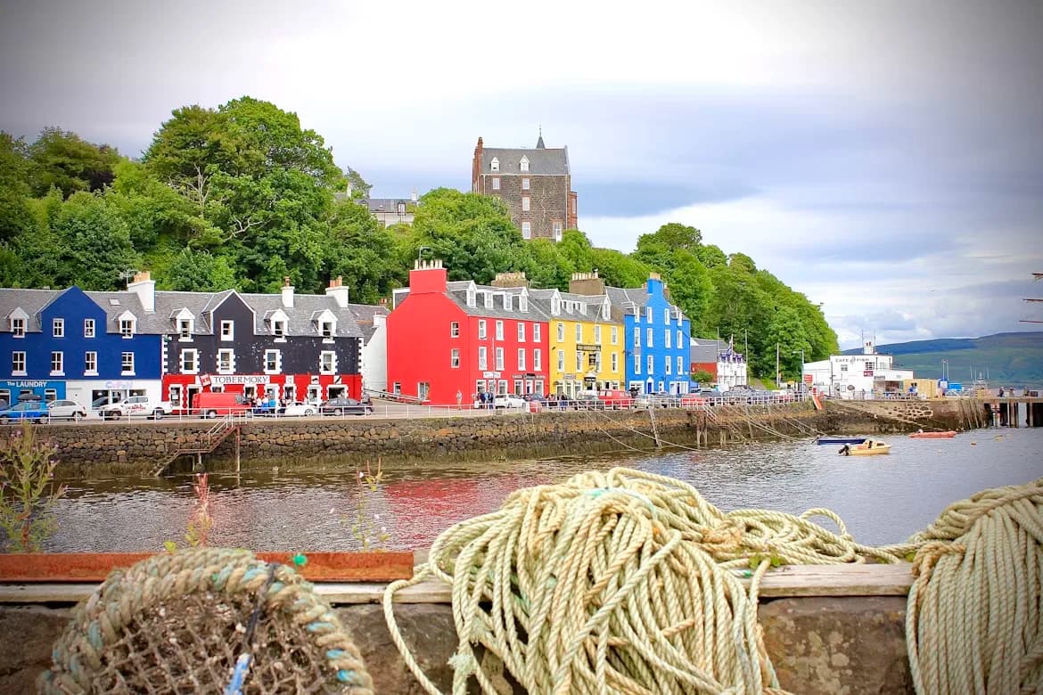 A row of colorful houses lines the harbor of Tobermory, a picturesque village on the Isle of Mull.